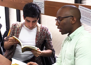 Pedro Monque and Garry Mitchell discussing a book